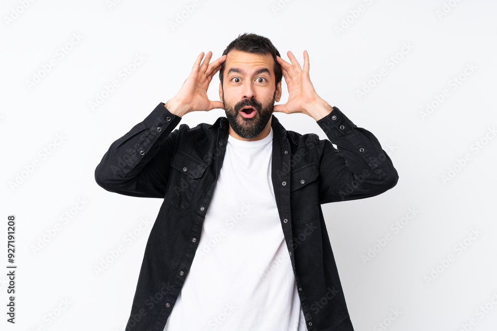 Young man with beard over isolated white background with surprise expression Young man with beard over isolated white background with surprise expression