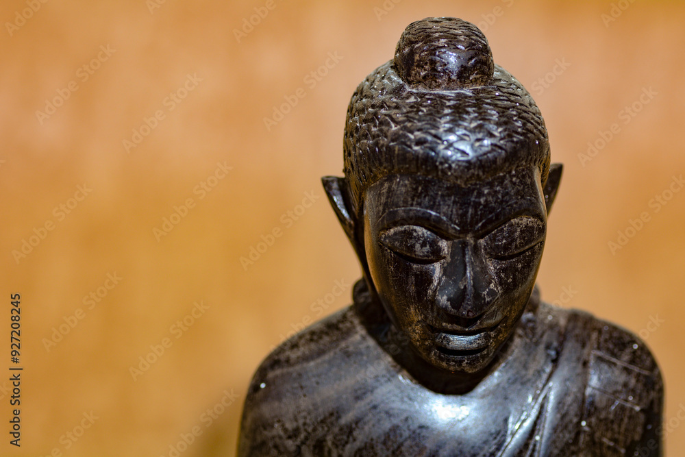 Fototapeta premium Face of a wooden Buddha figure