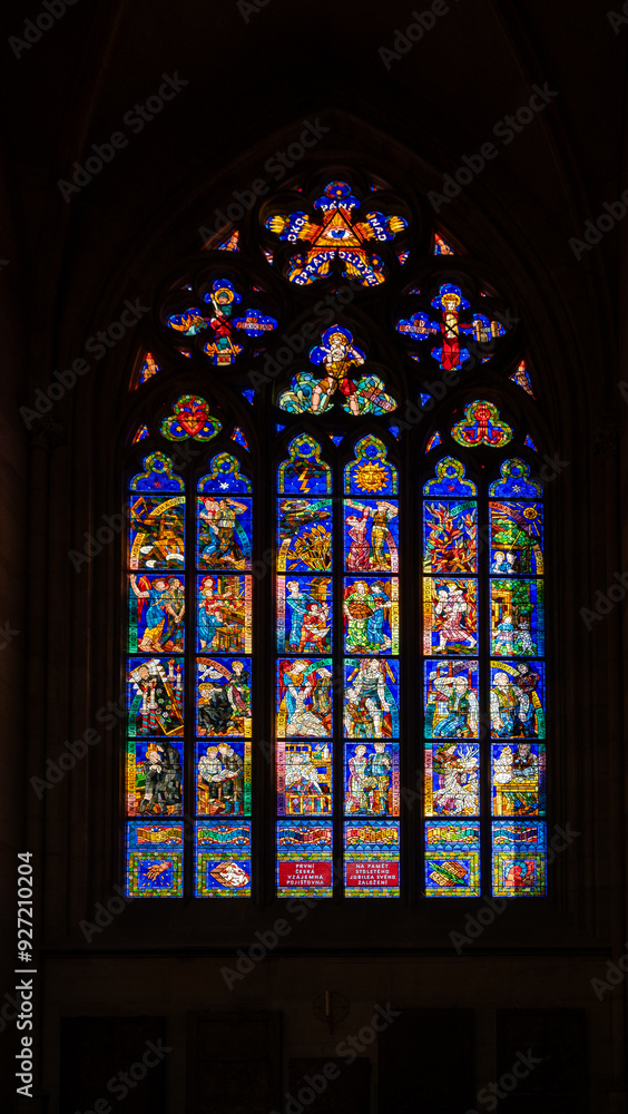 Amazing stained glass window of St. Vitus Cathedral - Prague Castle. Prague, Czech Amazing stained glass window of St. Vitus Cathedral - Prague Castle. Prague, Czech