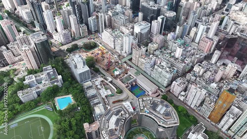 Hong Kong Kowloon Mong Kok railway station construction redevelopment near Sai Yee Street Argyle Street,building a towering green commercial skyscraper, showcasing urban innovation and architectural photo