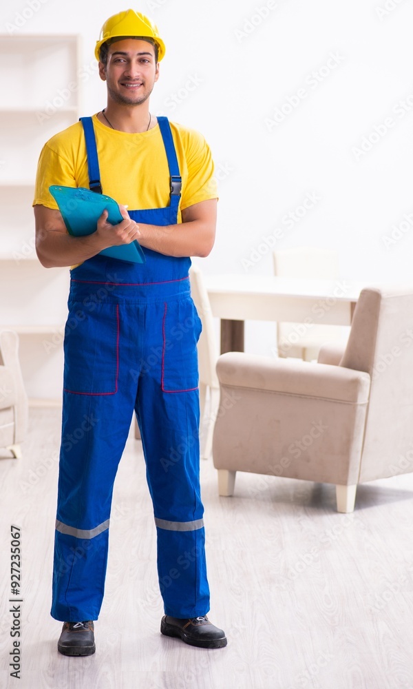 Young male contractor in relocation concept Young male contractor in relocation concept
