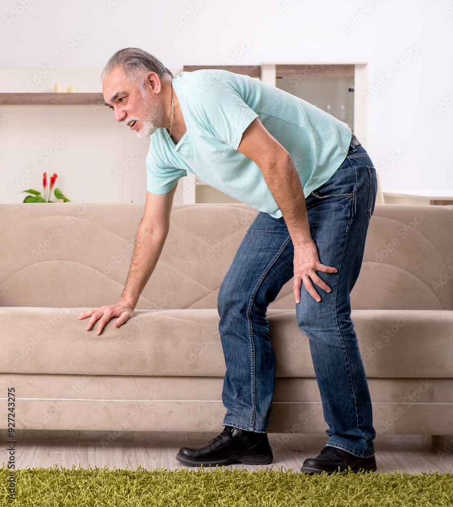 White bearded old man suffering at home
