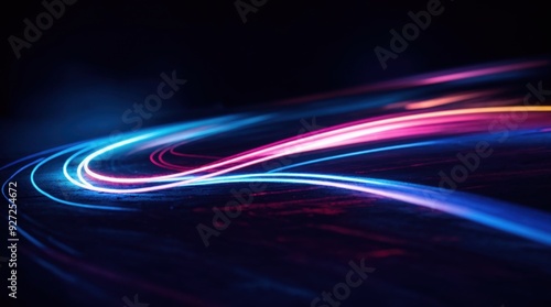 Striking neon shades swirling and turning in the dimness, implying a vibrant dance 