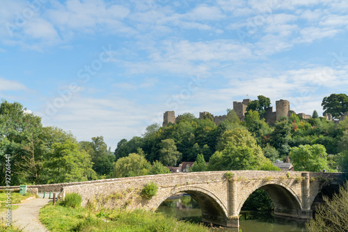 Dinham bridge over the River Teme with Ludlow castle behind in the town of Ludlow, Shropshire UK in Landscape orientation photo