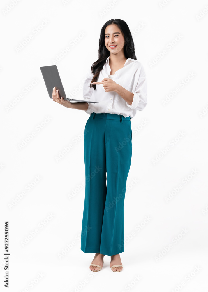 Cheerful beautiful Asian businesswoman holding laptop and looking forward on white background. Cheerful beautiful Asian businesswoman holding laptop and looking forward on white background.