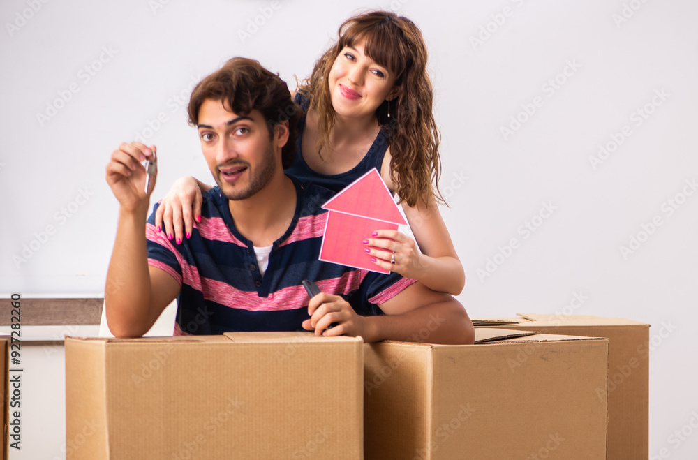 Young family moving to new house apartment Young family moving to new house apartment