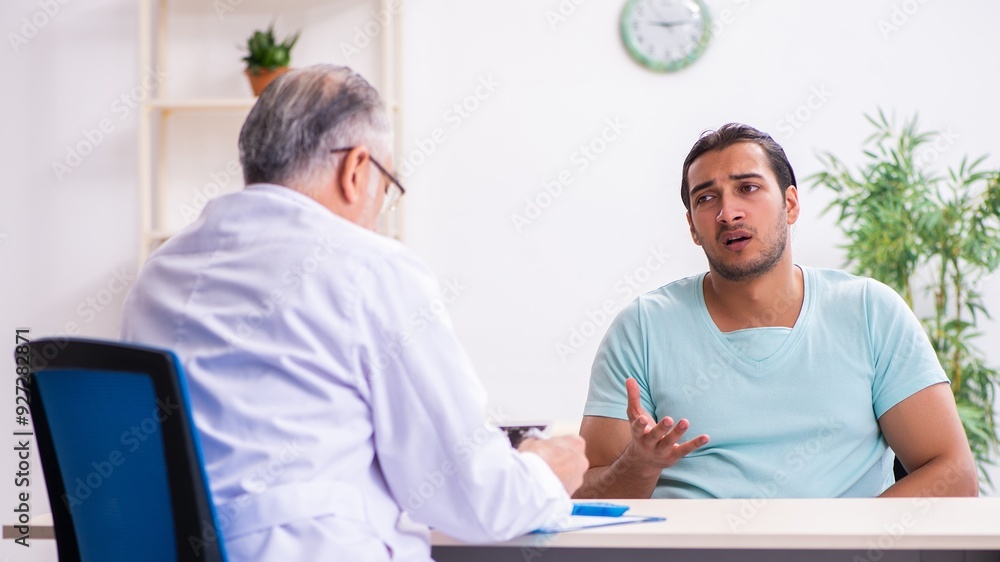 Young male patient visiting experienced doctor Young male patient visiting experienced doctor
