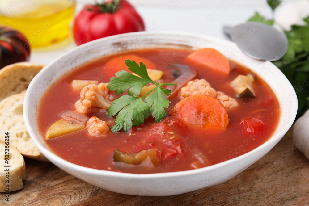 Delicious homemade stew in bowl and bread on table, closeup Delicious homemade stew in bowl and bread on table, closeup