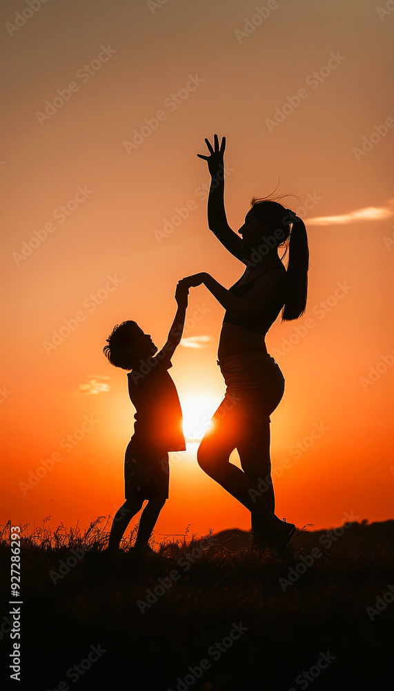 Silhouette of a mother and child dancing at sunset Silhouette of a mother and child dancing at sunset