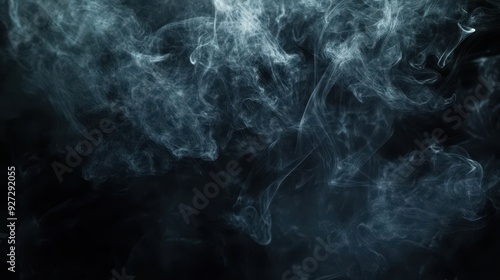 A swirling pattern of smoke against a dark background, creating a mysterious atmosphere.