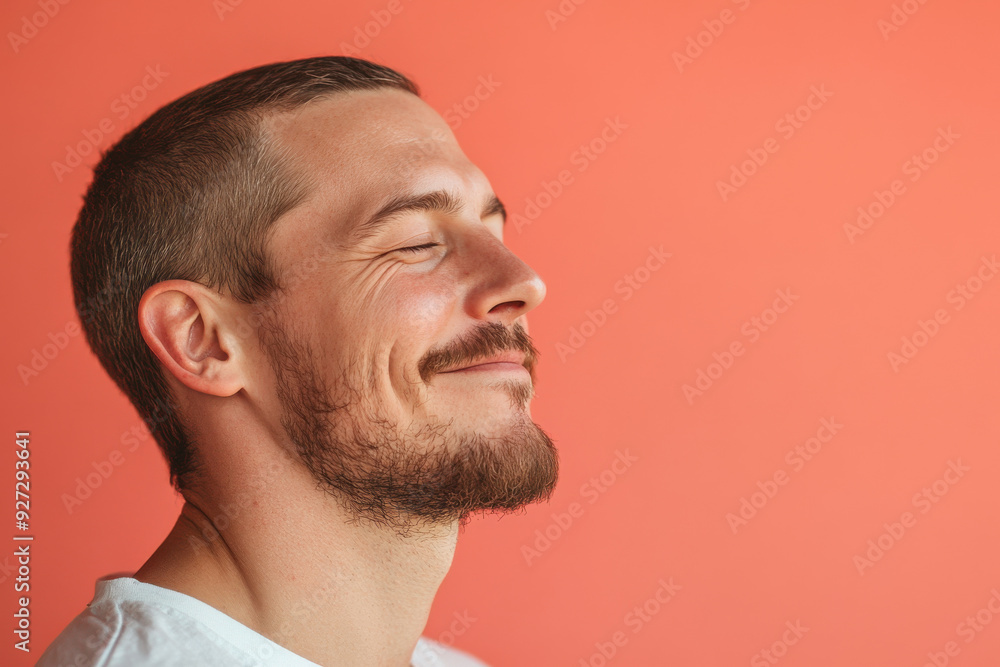 A close up of a man's face with her eyes closed