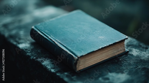 Close-Up of an Old Book on a Stone Surface