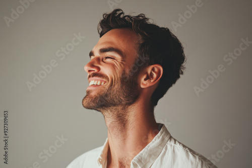 A close up of a man's face with her eyes closed