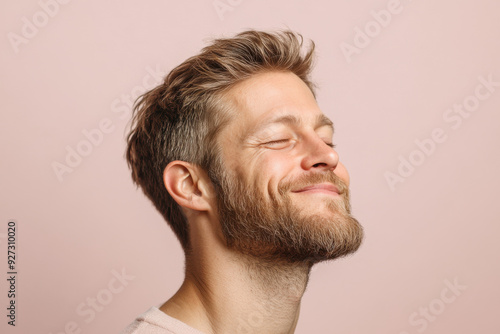 A close up of a man's face with her eyes closed