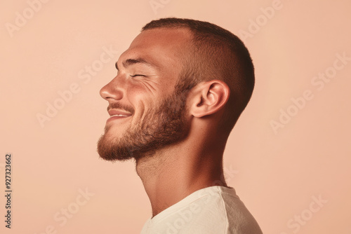 A close up of a man's face with her eyes closed