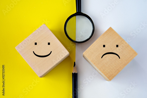 Photos Pessimism and optimism - on wooden triangles on a gray-blue background