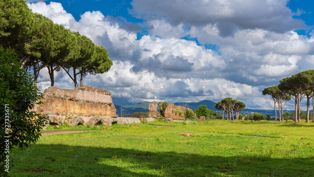 Ancient roman aqueduct ruins in Rome public park with beautiful clouds Ancient roman aqueduct ruins in Rome public park with beautiful clouds