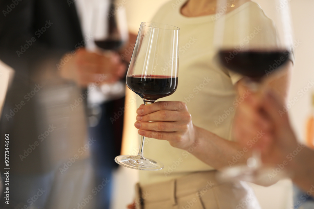 Friends with glasses of red wine, selective focus Friends with glasses of red wine, selective focus