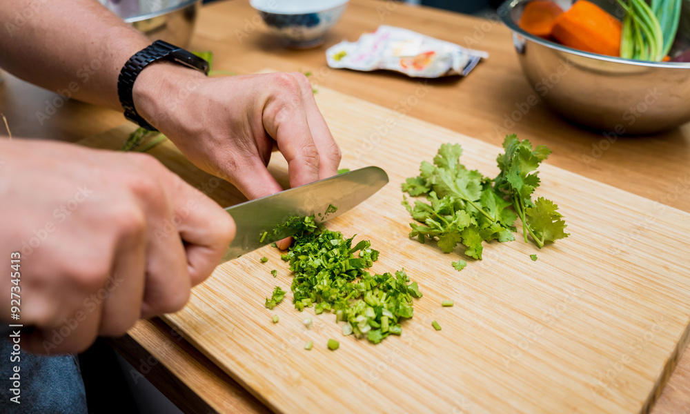 Chef at the kitchen preparing massaman curry with sweet potato and many spices Chef at the kitchen preparing massaman curry with sweet potato and many spices