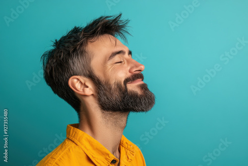 A close up of a man's face with her eyes closed