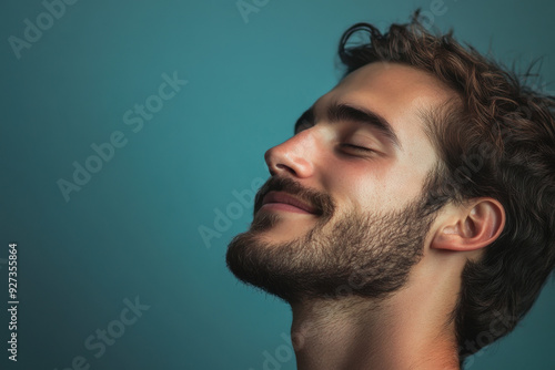 A close up of a man's face with her eyes closed