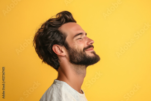 A close up of a man's face with her eyes closed