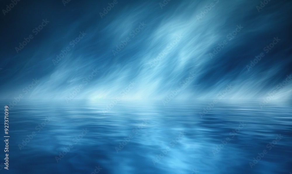 An abstract blue background with defocused, blurred motion, suitable for creating a sense of depth and movement.