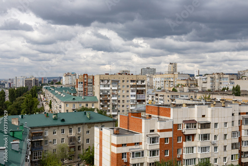 Summer urban landscape. Apartment buildings. Architecture of the city of Saratov, Russia. Clouds in the sky.
