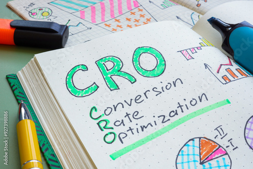 Open notebook with the text CRO Conversion rate optimization. Digital marketing strategy and performance enhancement. photo