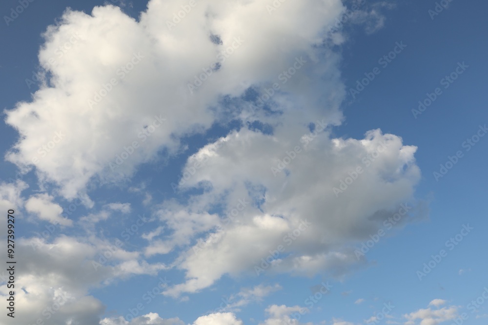 Picturesque view of blue sky with fluffy clouds Picturesque view of blue sky with fluffy clouds