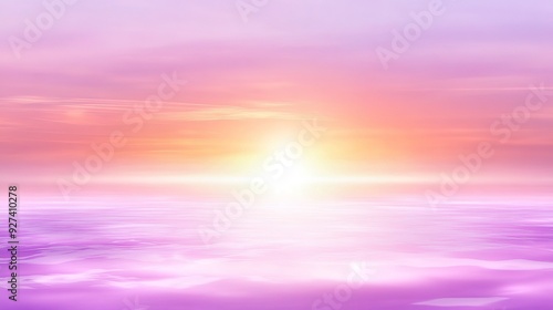 Sun setting over a tranquil ocean, casting vibrant hues of pink and orange across the sky and water surface at dusk