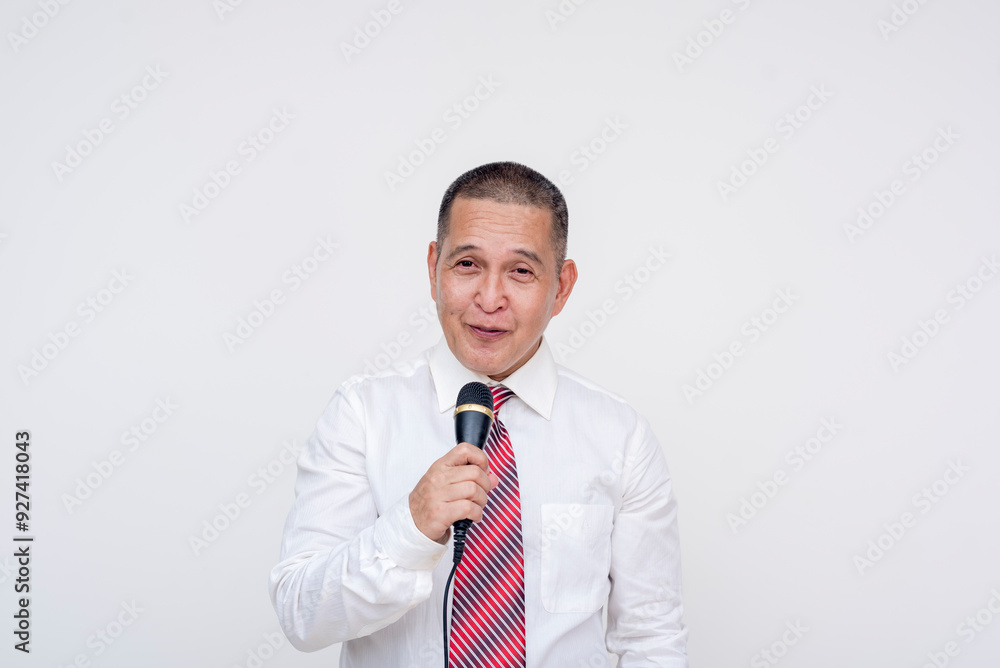 A middle aged asian Christian pastor giving a lecture. Using a microphone. Isolated on a white background.