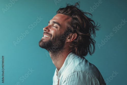 A close up of a man's face with her eyes closed