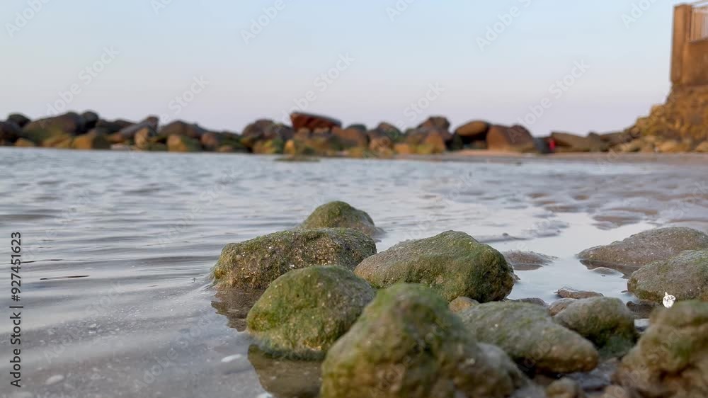 Sea water flows calmly between the rocks Sea water flows calmly between the rocks