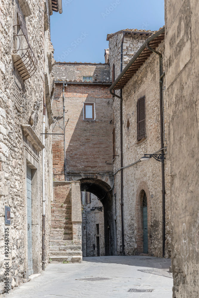 old stone houses on bending lane at medieval hilltop little town, Narni, Italy
