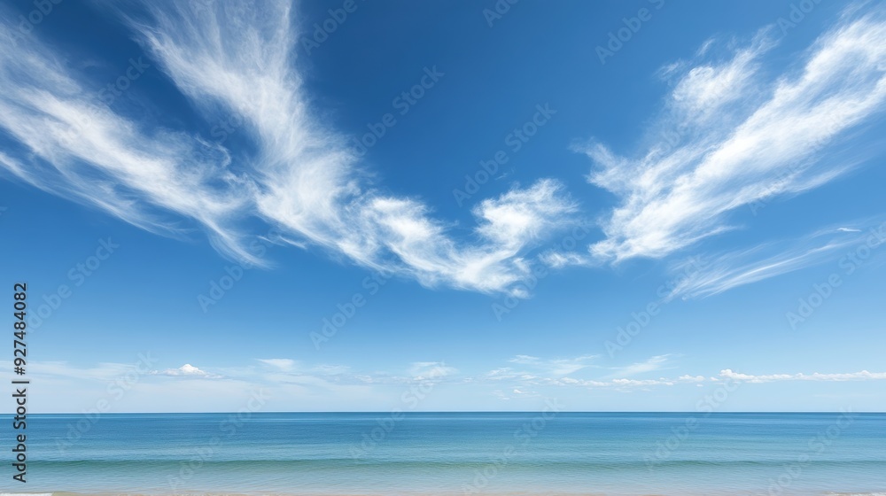 Fototapeta premium Tranquil Beach Bliss - Clear Sky and Wispy Clouds Over Horizon