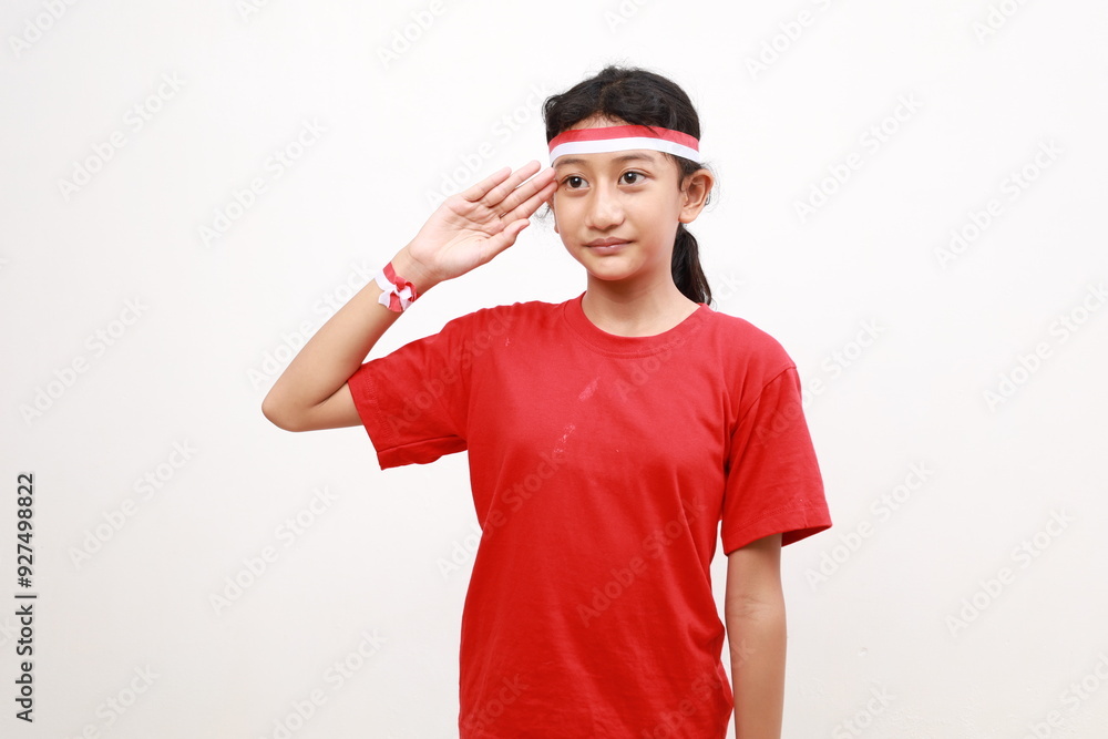 Beautiful Asian girl giving salute celebrate Indonesian independence day on August 17 isolated over white background Beautiful Asian girl giving salute celebrate Indonesian independence day on August 17 isolated over white background
