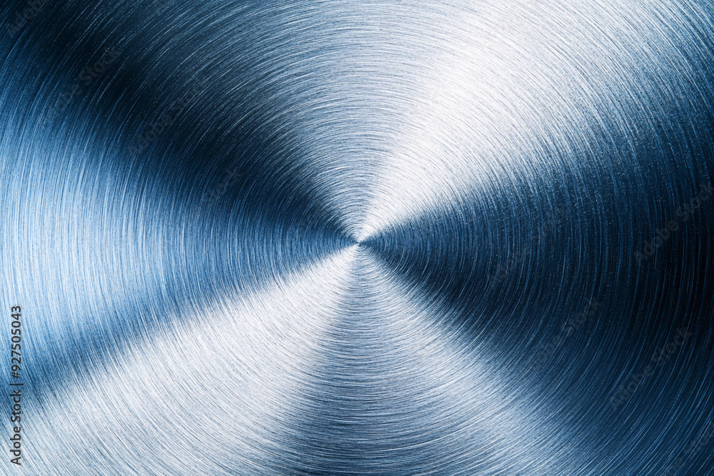 A silver metal object with a curved edge A silver metal object with a curved edge