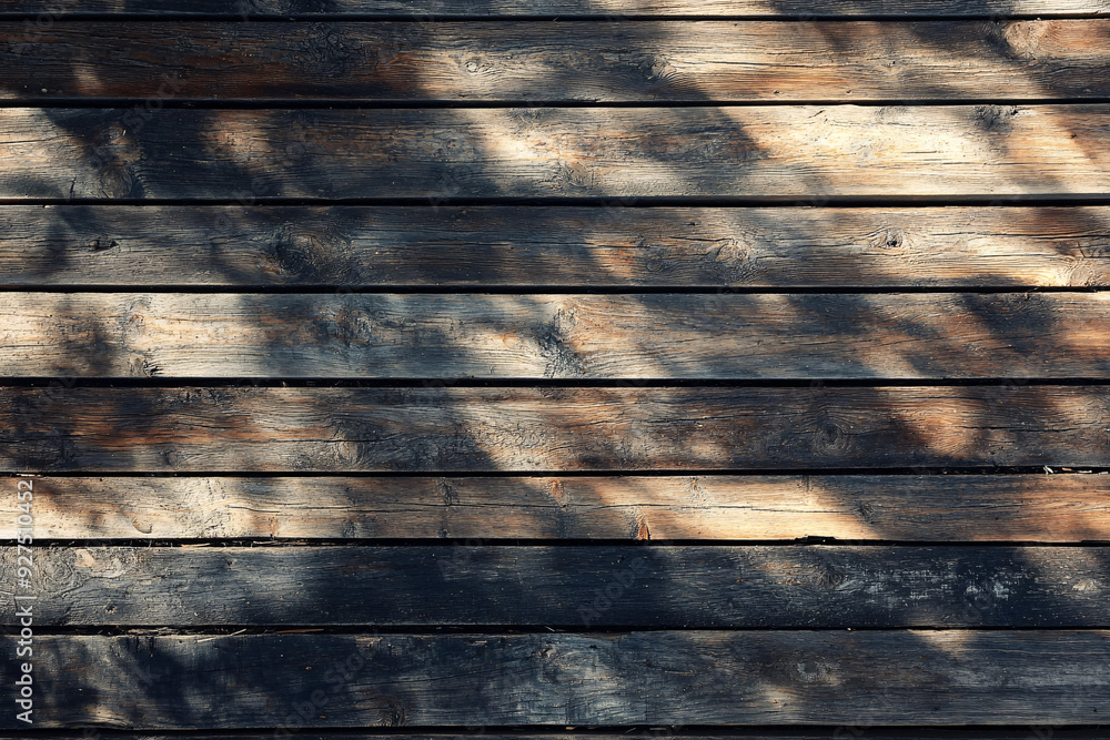 Fototapeta premium A wooden surface with a shadow cast on it