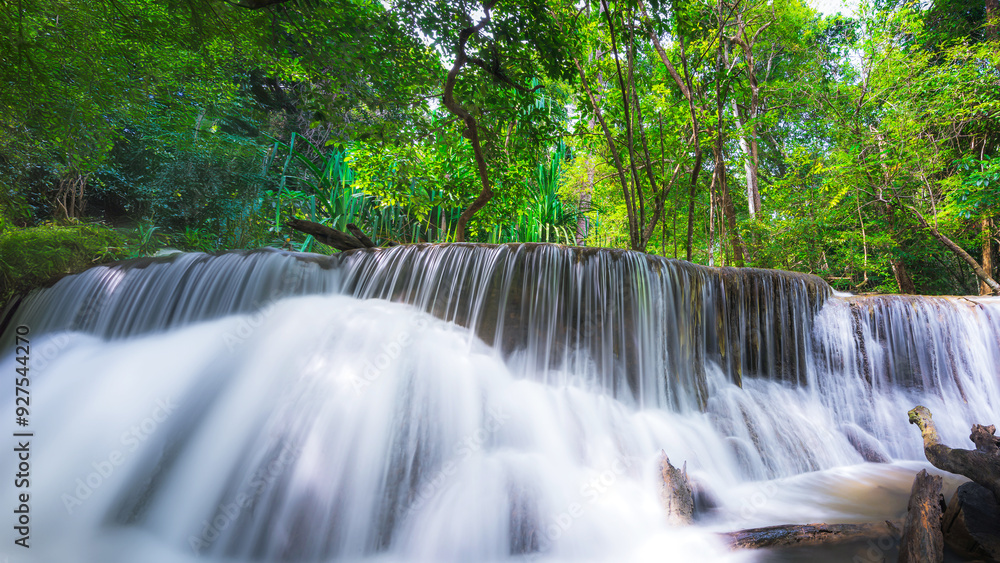 Obraz premium Beauty in nature, amazing waterfall in tropical forest of national park, Thailand
