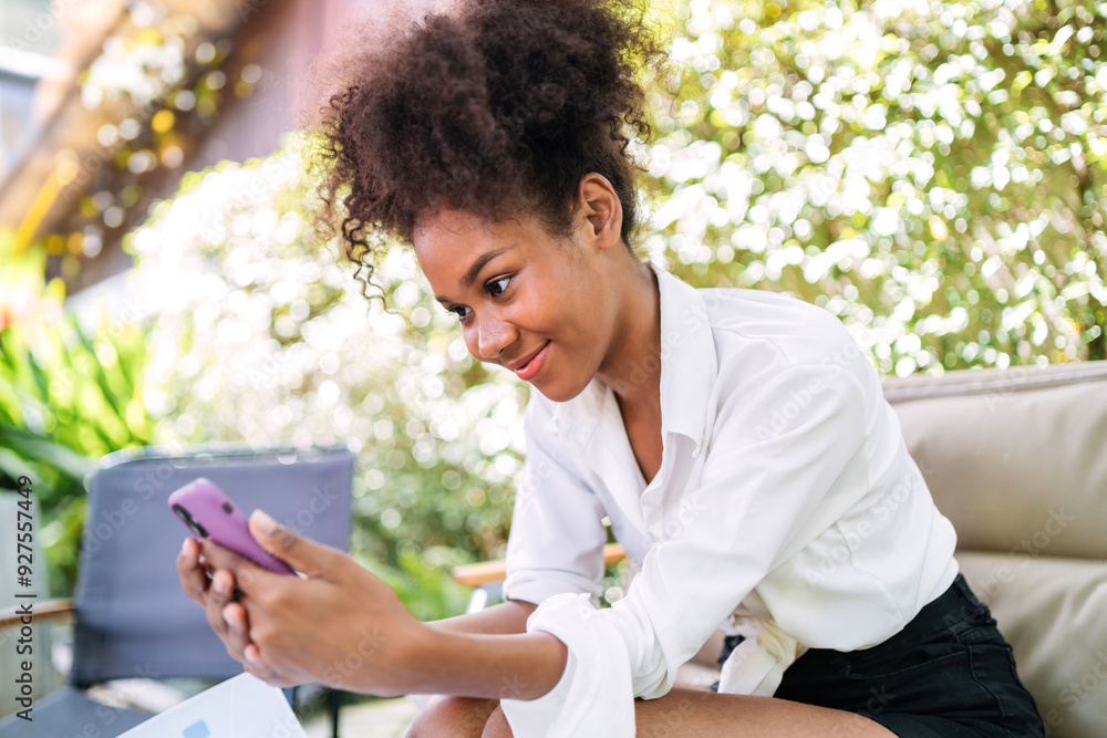 joyful black girl video call selfie using phone. black girl live talking to distance person outdoors or taking selfie. young african american student happy taking picture of herself using smartphone joyful black girl video call selfie using phone. black girl live talking to distance person outdoors or taking selfie. young african american student happy taking picture of herself using smartphone