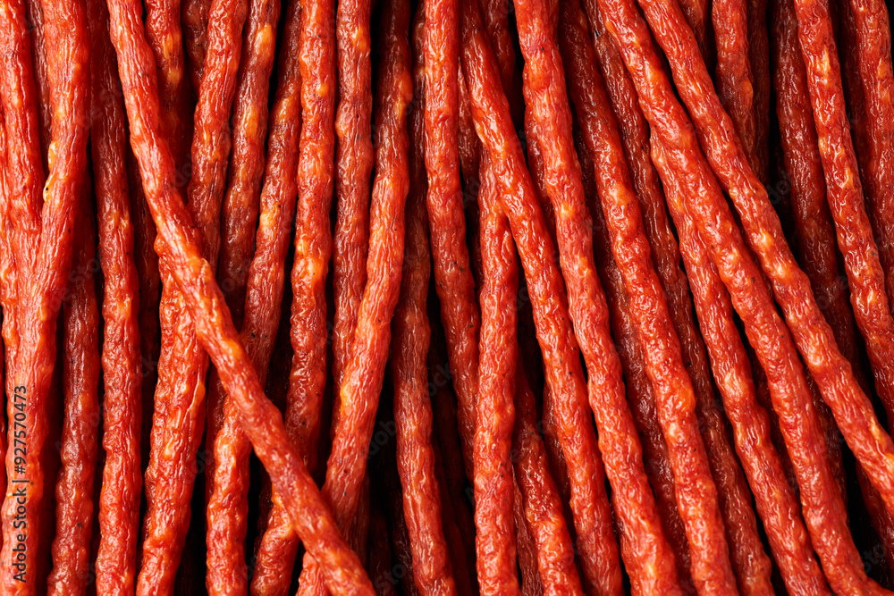 Tasty kabanos pork and herbs sausages on rustic stone board Tasty kabanos pork and herbs sausages on rustic stone board