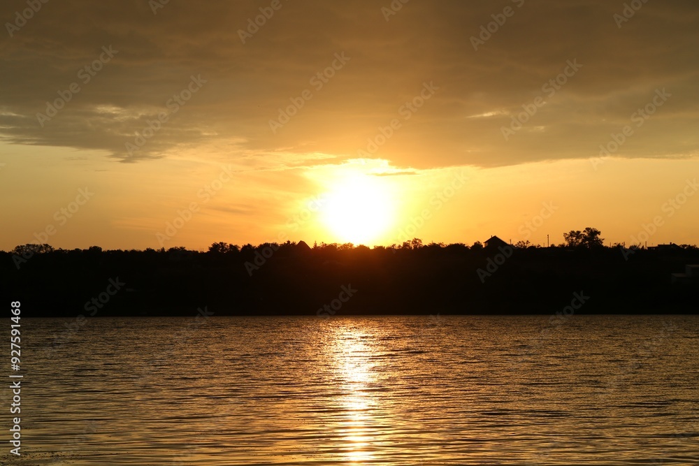 Picturesque view of beautiful sunset over lake Picturesque view of beautiful sunset over lake