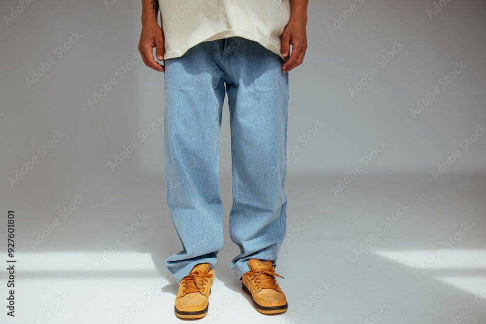 Casual mens fashion showing modern light blue jeans design. The image highlights comfort and style of light denim in contemporary fashion for people.