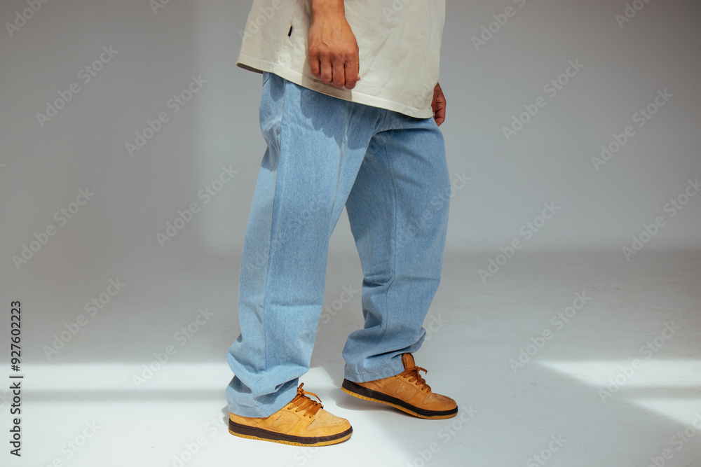 Casual mens fashion showing modern light blue jeans design. The image highlights comfort and style of light denim in contemporary fashion for people.