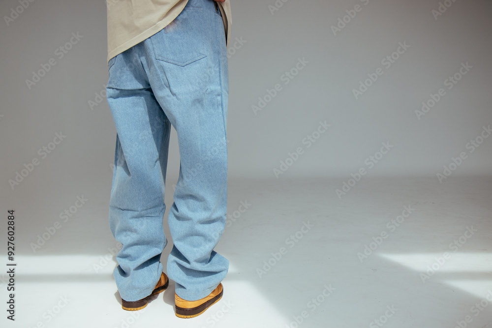 Casual mens fashion showing modern light blue jeans design. The image highlights comfort and style of light denim in contemporary fashion for people. Casual mens fashion showing modern light blue jeans design. The image highlights comfort and style of light denim in contemporary fashion for people.