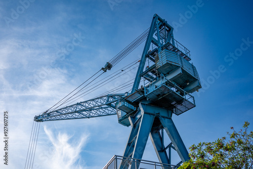 An old crane near a harbor canal in Offenbach am Main, Germany
