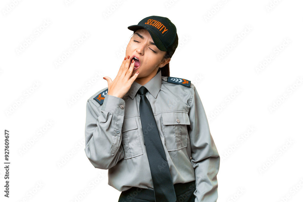 Young safeguard woman over isolated chroma key background yawning and covering wide open mouth with hand Young safeguard woman over isolated chroma key background yawning and covering wide open mouth with hand