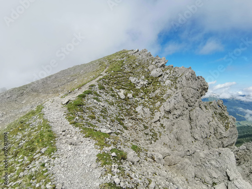 hiking path over the mountain peaks photo