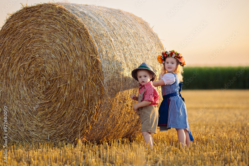 Child in wheat field with German bread Child in wheat field with German bread